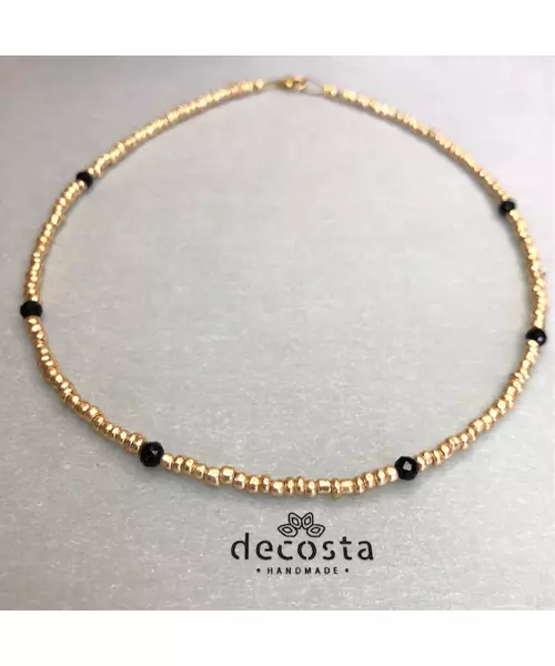 Golden necklace with black crystals