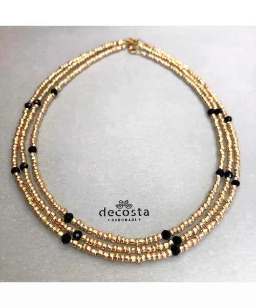 Golden necklace with black crystals